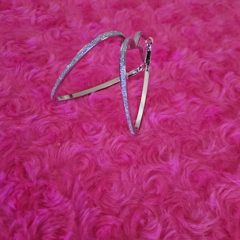 Silver heart shaped sparkle earrings